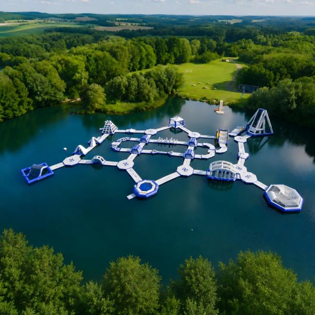 Inflatable Water Park With Floating Obstacles Slides And Climbing Areas
