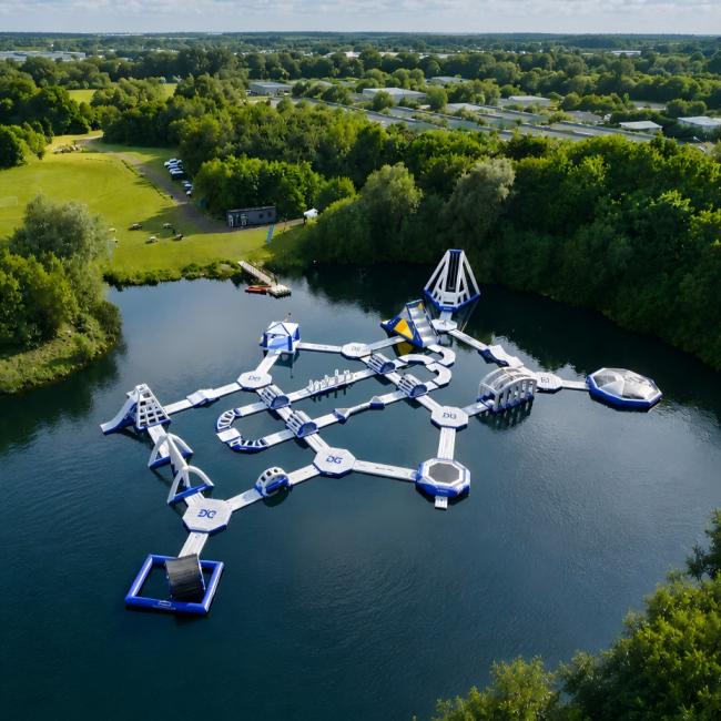 Inflatable Water Park With Floating Obstacles Slides And Climbing Areas