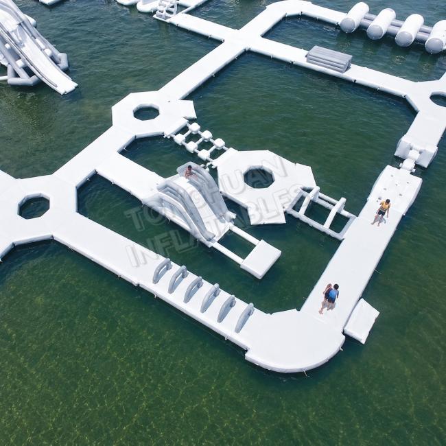 Large Floating Aqua Park Custom PVC Water Park Slides Climbing Zones Jump Platforms Beach Lake Playground