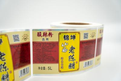 China Etiquetas impermeáveis personalizadas removíveis para garrafas Adesivo Transparente Autocolantes à prova de adulteração à venda