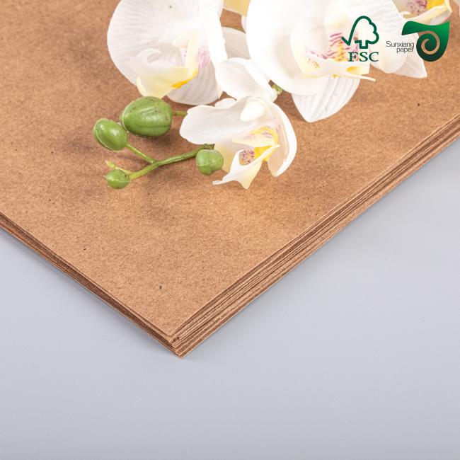 Close-up view of food-safe kraft cardboard material and surface finish