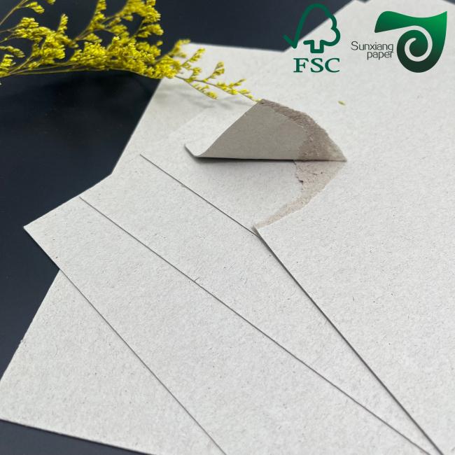 Cardboard sheet being used in book binding application