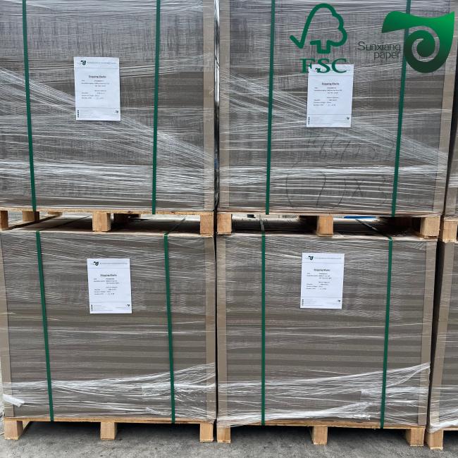 Grey cardboard sheets stacked showing thickness variations