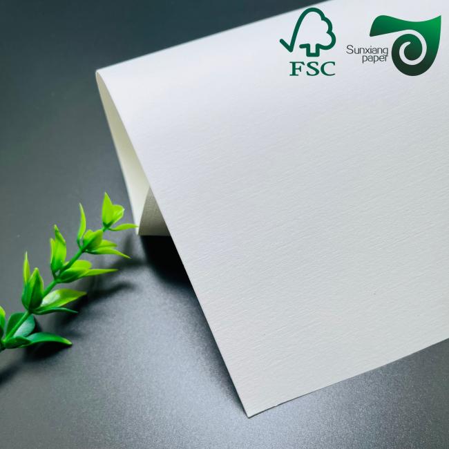 Close-up view of cloth texture embossed paper showing detailed surface pattern and texture