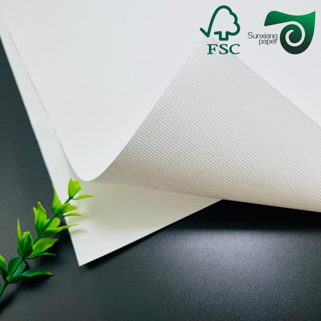 Embossed white cardstock sample demonstrating premium quality and finish