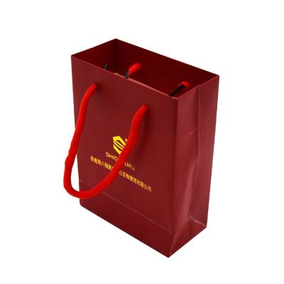 China Eco Friendly Custom Paper Shopping Bags 210gsm Craft Gold Foil With Cotton Rope Handle for sale