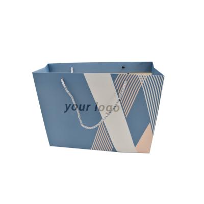 China Craft Paper Small Blue Custom Paper Shopping Bags With Ribbon for sale
