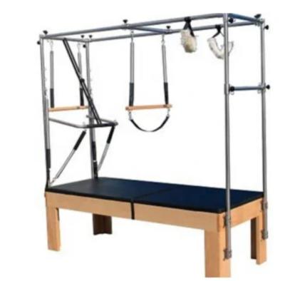 China Máquina de ejercicios de trapecio de madera Pilates de gimnasio con muelles en venta
