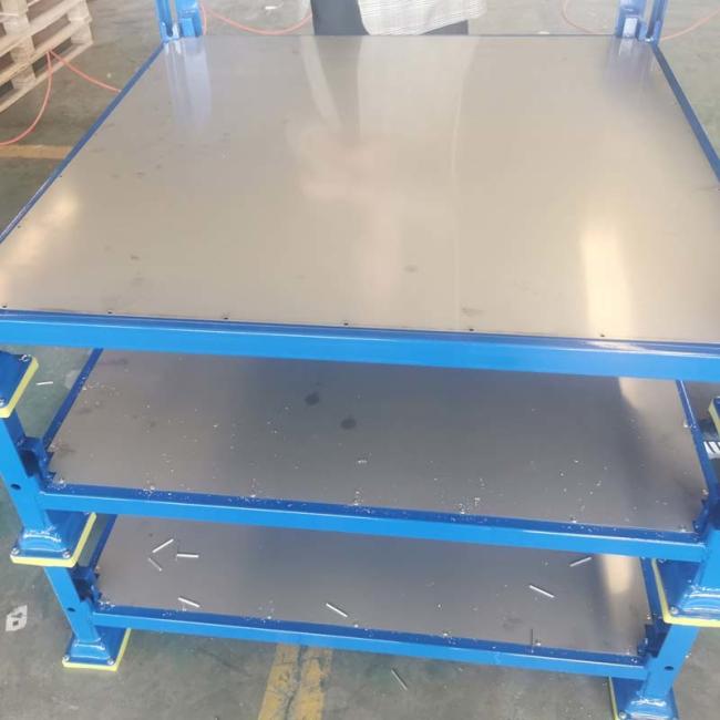 Stackable metal pallet bins in industrial use