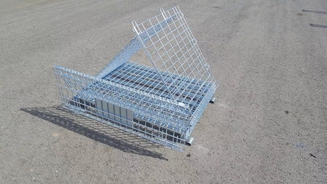 Warehouse setup with multiple wire mesh containers in use