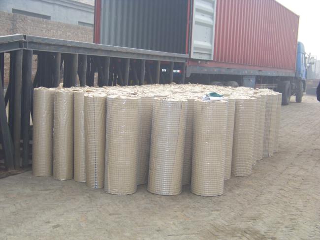 Close-up view of welded wire fence construction showing precise openings and galvanized coating