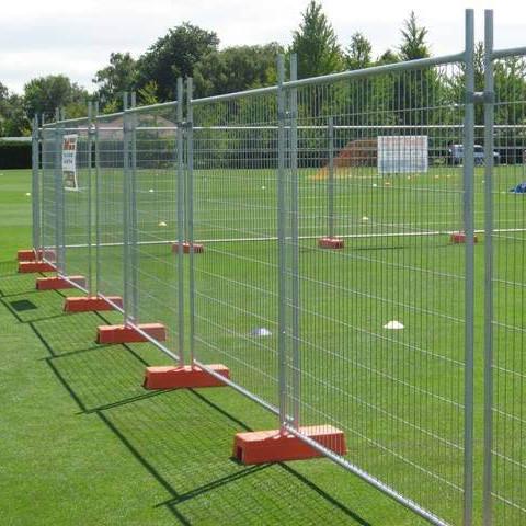 Close-up view of temporary fence mesh and construction