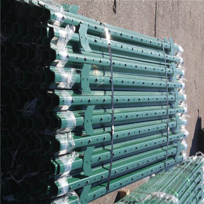 Close-up view of T-post construction with anchor plates and corrosion-resistant coating
