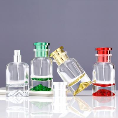 China Botella de perfume colorida con los casquillos en venta
