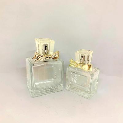 China 50ml 100ml Exquisite Perfume Bottle Glass Bottle Alloy Bow Spray Empty Bottle Matching Factory Customization for sale