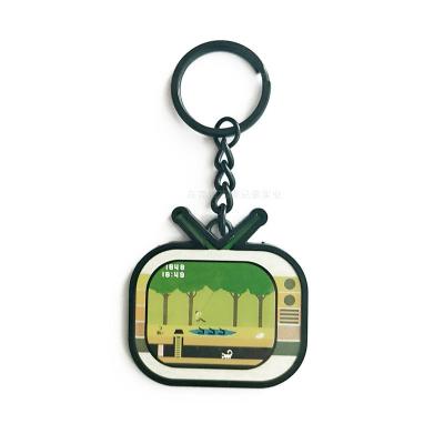 Китай Сплав цинка формы ТВ ключевого кольца металла логотипа лазера мультфильма для подарков детей продается