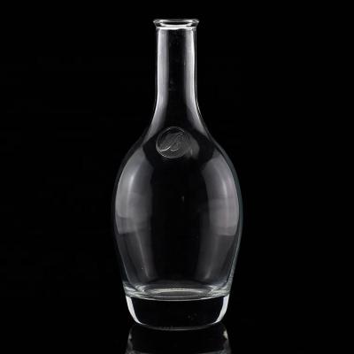 China Acid Etch Surface Handling Tequila Glass Bottles with Round Neck and Empty Flint for sale