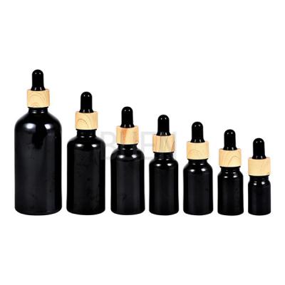 China Botella de cristal cosmética de bambú del dropper, dropperes de Cyinder para los aceites esenciales en venta