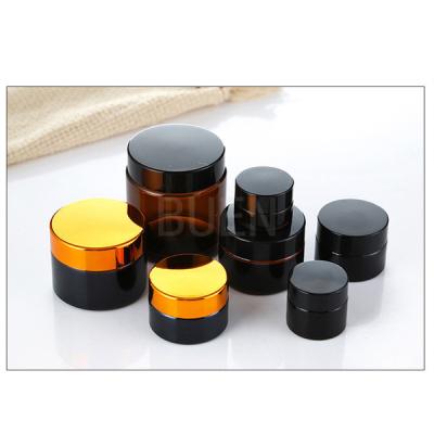 China Dauerhafte kosmetische Verpackenflaschen Buen-Golddeckel-Amber Glass Jars Nons BPA zu verkaufen