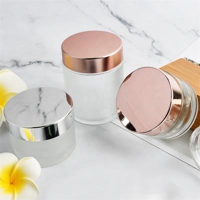 China Makeup Clear Glass Cosmetic Jars Bottles Custom Painting Matte Pink Lid for sale