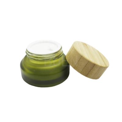 China Blue Glass Cosmetic Jars For Moisturizer Inclined Shoulder With Bamboo Lid 5g for sale