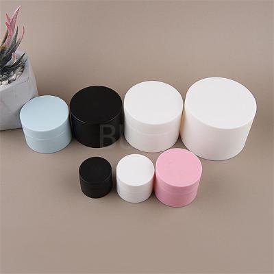 China Matt White black pink plastic cosmetic cream jar container double wall jars for sale
