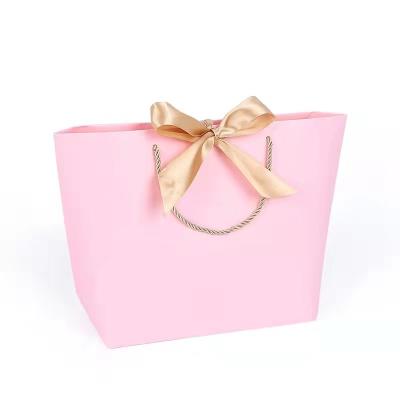 China Personalized Luxury Custom Crafts Handmade Pink Coated Art Paper Cosmetics Clothes Jewelry Gift Bag Small for sale
