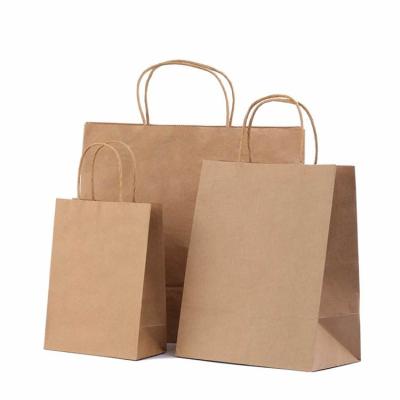 China Plain Kraft Biodegradable Brown Paper Bags With Handles for sale