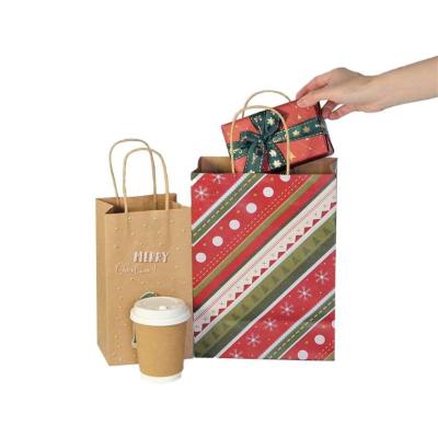 中国 印刷される新年のギフトのクリスマスのギフト袋はクラフトCMYKをリサイクルする 販売のため