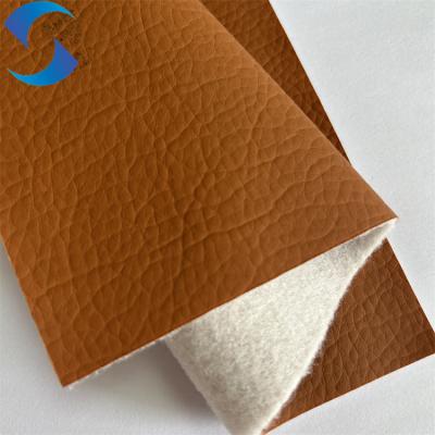 China 100% Polyester Non Woven Backing  Artificial Leather Fabric Embossed Pattern for sale