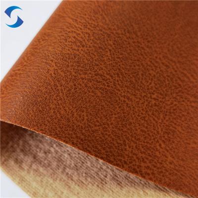 China Ancho 140/160 Tejido de tejido de cuero de PVC 0,7 mm ± 0,05 100% poliéster técnica de apoyo cepillado para la cubierta del asiento del automóvil en venta