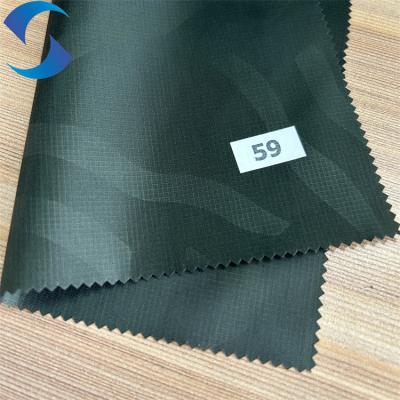China Light Weight Polyester 260T Taffeta Fabric Cire Ripstop Printing Fabric With PU Coating à venda