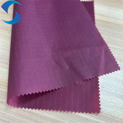 China 100% Nylon Fabric With PU Coating 70D*210T 0.5cm Ripstop Semi Dull For Camping Bag for sale