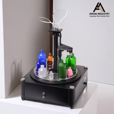 China Cosmetic Liquid Small Perfume Bottle Filling Machine, Round Bottle Filling Line for sale