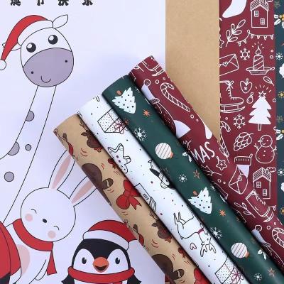 China Merry Christmas Gift Wrapping Paper 58cm X 58cm Printed Kraft Paper 20 Sheets In Bag for sale