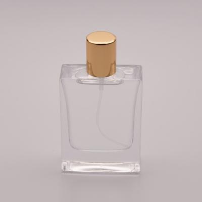 China 50ml Flat Glass Perfume Bottle With Small Gold Cap for sale