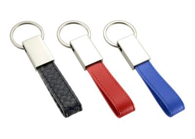 China PU Leather Key Chains Zinc Alloy Debossed Logo Mini Key Holder Leather Strap for sale