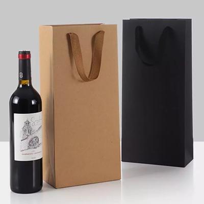 China Cmyk Printed Paper Carrier Bags 11*35*9cm Kraft Wine Bottle Bags for sale