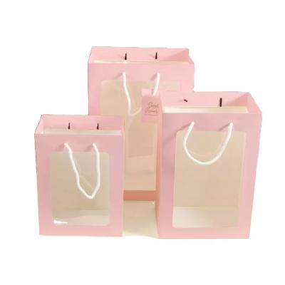 China Handmade Offset Printing Kraft Paper Gift Bags With Clear Window for sale