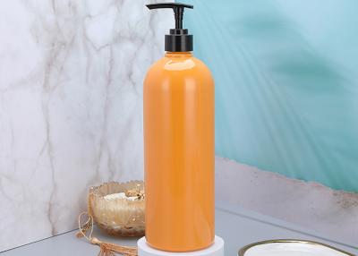 China 25mm Orange Shampoo Plastic Pump Dispenser Bottles 900ml for sale
