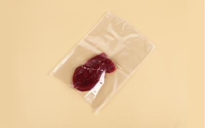 Chine Hauts sacs de congélateur de rétrécissement d'eau chaude de PE de PA de barrière de catégorie comestible pour la viande fraîche à vendre