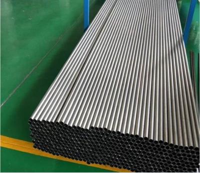 China Gr3 Pure Titanium Alloy Pipes ASTM B338 1 Inch 2 Inch Titanium Tubing For Heat Exchanger for sale