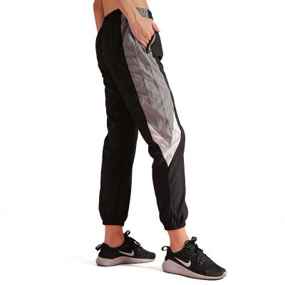 China Woman Cropped Pants Quick Dry With Pocket  Running Workout Leggings for sale