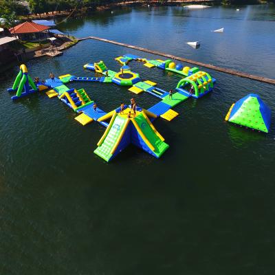 China PVC Tarpaulin 0.9mm Water Jump Park Floating Trampoline Games TUV Certification for sale