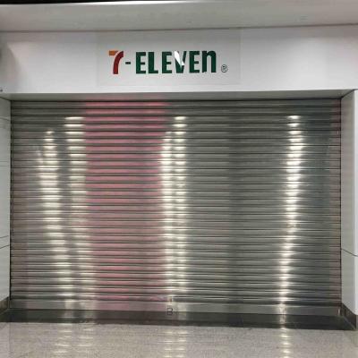 China Puerta de rodadura automática de acero inoxidable, puertas de persianas de rodillo de almacén de seguridad en venta
