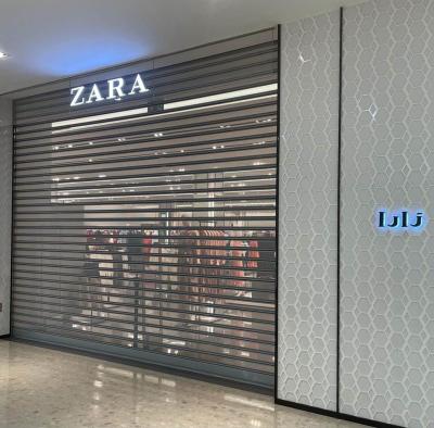 China Transparent Perforated Steel Roller Shutter Door For Shopfront for sale