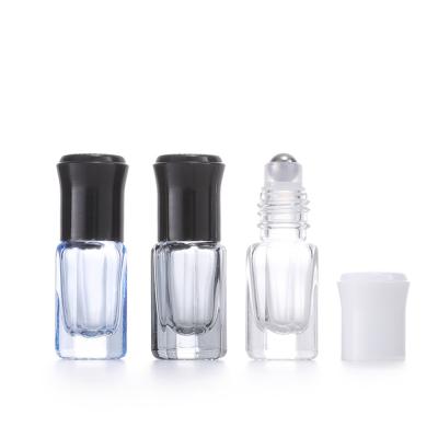 China Octagonal Small Massage Roller Bottles Steel Ball Essential Oil Bottle Vials Glass Perfume à venda