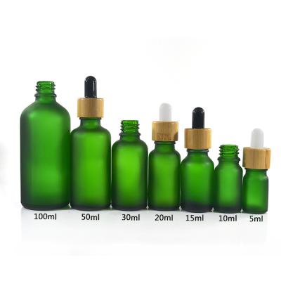 China Botellas de cristal del aceite esencial del color verde, 1 botellas de cristal redondas de la onza 2 onza 4 onza Boston en venta