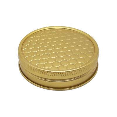 China Aluminum Honeycomb Pattern Gold 65mm Honey Bottle Cap for sale