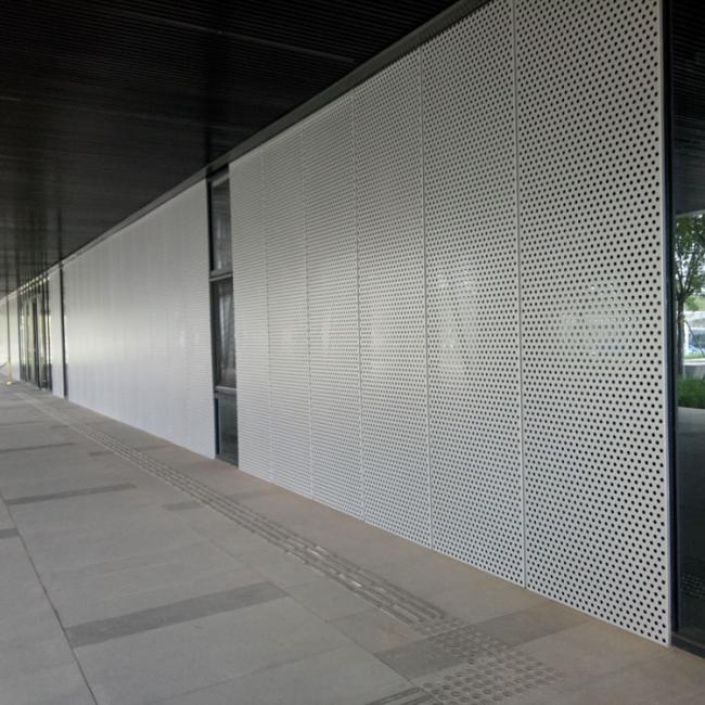 Installed perforated aluminum ceiling panels
